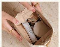 Nouvelle pochette cosmétique de luxe en cuir PU imperméable de marque personnalisée pour femmes de marque mini trousse de maquillage de voyage