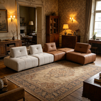 Canapé d'angle élégant en cuir véritable avec coussins rembourrés en éponge, forme carrée, design moderne pour salon de villa