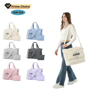 Bolsa de gimnasio personalizada BSCI para mujer, bolso informal, lona de fin de semana con puerto USB, bolsillo húmedo y compartimento para zapatos para viajes - Product Image 1