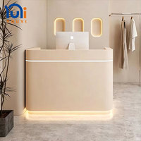 Comptoir de réception incurvé de style nordique avec éclairage LED pour magasin de vêtements, salon de beauté ou SPA