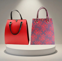 Boîte cadeau de luxe pliable en cuir texturé de style sac à main rouge personnalisée Dr. Box avec boucle métallique et poignée pour vin