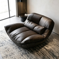 Fauteuil inclinable en cuir noir surdimensionné de style bohème, coque incurvée en fibre de verre, canapé individuel pour un espace intérieur minimaliste