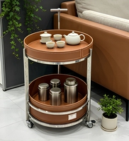 Chariot à thé moderne fait main en acier inoxydable et cuir, durable et écologique, avec roues et design de selle amovible, pour salon et mobilier de maison