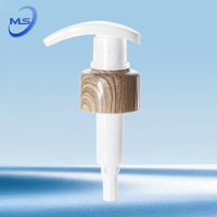 Distributeur de pompe de désinfectant pour les mains en plastique luxueux avec un beau bouchon de bec imprimé en bambou de grain de bois pour bouteilles