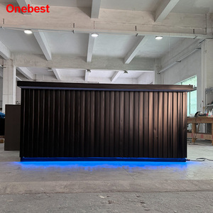 Bancone da <span class=keywords><strong>Bar</strong></span> in Pietra Artificiale Nera con Luci LED e Decorazioni in Lamiera Ondulata - Product Image 1