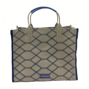 กระเป๋าผ้าแคนวาสสีขาวสำหรับผู้หญิง ทนทาน กันน้ำ ใช้ซ้ำได้ หูหิ้วริบบิ้นน่ารัก พร้อมช่องใส่ของแบบสาน เหมาะสำหรับช้อปปิ้งประจำวันและไปเที่ยวชายหาด - Product Image 1