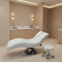Lit de pose de cils ergonomique incurvé noir mat avec base en forme de croix, lit d'extension de cils, lit de spa beauté