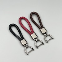 Vente chaude : Porte-clés de luxe pour voiture, style professionnel et mode, compact, en corde tressée à la main, avec mousqueton en alliage, léger et rotatif, forme fer à cheval