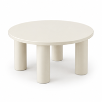 Table basse ronde moderne en crème avec pieds cylindriques pour salon