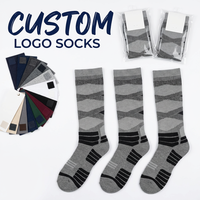 Chaussettes de ski en laine mérinos tricotées ODM, épaisses et thermiques pour l'hiver, avec logo personnalisé, chaussettes de basketball longues, chaussettes athlétiques montantes jusqu'au genou