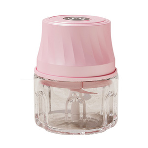 Picadora eléctrica de alimentos rosa con recipiente de vidrio y tapa de seguridad para uso en la cocina - Product Image 1