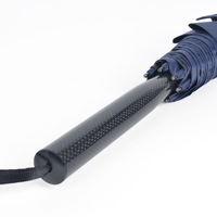 Parapluie de golf monobloc en fibre de carbone intégrale avec tige ultra-légère, revêtement noir anti-UV et cadre coupe-vent pour les professionnels