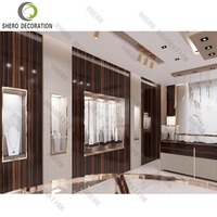 Vitrine de présentation de bijoux en verre avec éclairage LED, design intérieur de magasin de bijoux de luxe sur mesure