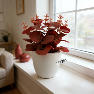 Plante d'<span class=keywords><strong>eucalyptus</strong></span> artificielle à feuilles rondes de couleur rougeâtre dans un <span class=keywords><strong>pot</strong></span> <span class=keywords><strong>en</strong></span> céramique blanc avec un faux sol noir <span class=keywords><strong>pour</strong></span> une décoration minimaliste et automnale - Product Image 1