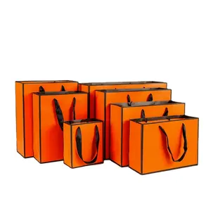 批发高品质定制新设计标志廉价礼品橙色纸袋包装袋