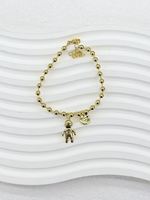 Bracelet en chaîne dorée avec perles de cristal colorées, breloques pendantes en zircon et gemmes de formes variées (cœur, carré, ovale, goutte d'eau, marquise)