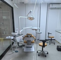 Fauteuil dentaire entièrement électrique avec commande de valve, égouttoir chauffant, visualiseur de radiographie et lampe opératoire LED