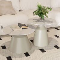 Table basse en acier artificiel avec base en métal noir et or