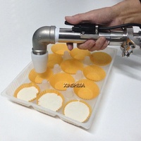 Machine professionnelle de dépose et de décoration de crème, de confiture et de garniture pour petits gâteaux, croissants, pains et biscuits commerciaux