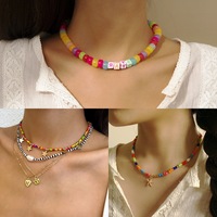 Collier de perles de riz colorées perlées à la main en gros mixte Style ethnique collier en acrylique poterie douce irrégulière pour les femmes