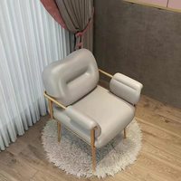 Fauteuil de manucure confortable et moderne en métal pour salon de beauté, style minimaliste, avec table de maquillage intégrée