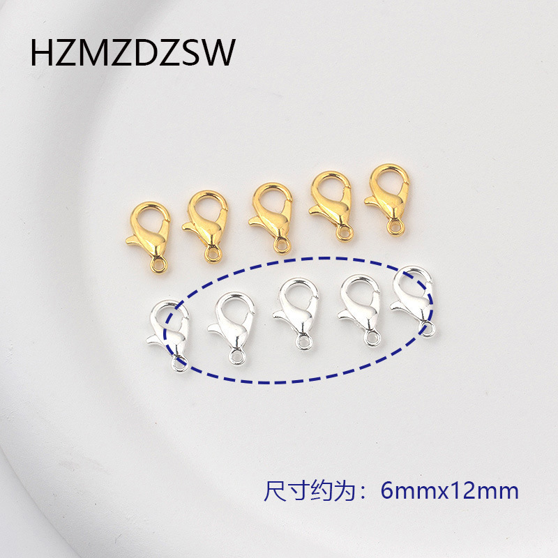 Boucle homard argentée, 12 mm, environ 20 pièces.