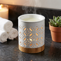 Brûleur d'huiles essentielles en céramique blanche de luxe, motif floral ajouré, support de bougie chauffe-plat, diffuseur de cire aromatique pour la décoration intérieure