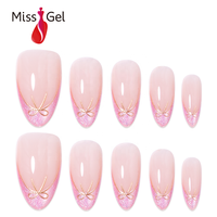 Faux ongles à presser Ombré French Tip avec nœud doré et paillettes roses, forme amande, longueur moyenne, style French, 32 pièces, à coller