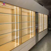 Vitrine d'exposition optique moderne Sundo avec éclairage arrière, comptoir îlot pour lunettes, fabricant d'agencements pour magasins d'opticiens