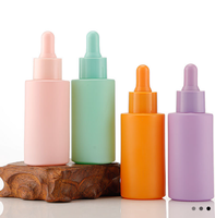 Flacon d'huile essentielle en verre personnalisé couleur macaron, flacon échantillon compte-gouttes à bouchon en silicone à épaule plate, flacons en verre pour produits de soin de la peau