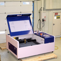 Machine de gravure/découpe laser CO2 4040 60W/40W Haute sécurité Économie d'énergie Refroidie à l'eau pour le bois Multifonctionnelle Écologique