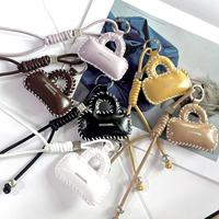Nouvelle mode : Décoration suspendue pour petit sac, faite main, en cuir et coton, avec corde tressée exquise en PU, porte-clés portable