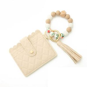 Wholesale <b>Men</b> Women Elastic Silicone <b>Bead</b> Bangle <b>Bracelet</b> Wallet Keychain Leather Tassel Wristlet Keychain Wallet - Product Image 1