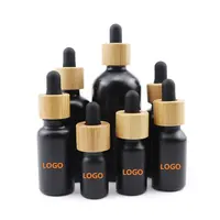 Leere 30 ml 1 Unze kosmetische ätherische Haaröl flaschen 30 ml Nagel haut gefrostete schwarze Glas-Tropf flasche mit Bambus deckel für cbd