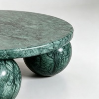 Table basse ronde de luxe en marbre vert avec base sphérique en marbre naturel au design minimaliste
