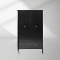Armoire noire à deux portes avec tiroir large, quincaillerie dorée et pieds effilés, meuble de rangement autoportant pour vêtements de chambre