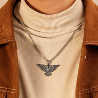 Colliers pendentifs en acier inoxydable tendance hip-hop punk créatif à double tête d'aigle religieux pour hommes en gros