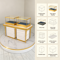Comptoir de présentation de bijoux compact et combiné, vitrine en verre à cadre fin doré avec base de rangement à tiroirs blancs et plateforme ronde en marbre