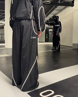 Ensemble survêtement en nylon personnalisé avec veste zippée en polyester, coupe ample, réfléchissant, imperméable et coupe-vent, et pantalon de jogging
