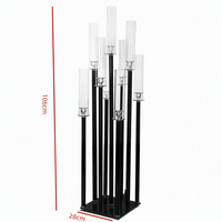 Candélabre en fer noir à 9 bras avec abat-jour en verre hurricane pour la décoration de table d'allée de mariage, d'hôtel ou de restaurant