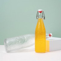 Vente en gros Bouteille en verre à couvercle oscillant 500 ml 1000ml Bouteilles d'eau pour boisson, bière et vin avec couvercle rabattable