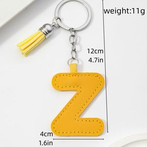 Nouveauté 2025 : Porte-clés en cuir PU avec 26 lettres anglaises et pompons en cuir colorés pour pendentif lettre nominative – Cadeau spécial - Product Image 6