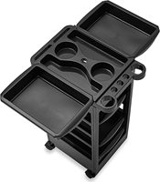 Chariot de coiffure moderne en plastique noir à 5 niveaux et 4 roues, avec vérin pneumatique, support pour bol de teinture et fonctions d'organisation, pour usage en salon