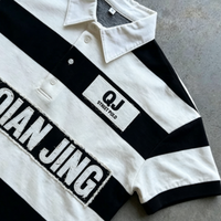 T-shirt polo ample en coton doux à épaules tombantes avec broderie personnalisée en 3D à rayures noires et blanches