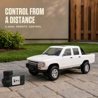 Camioneta RC 1:10 4WD 2.4G, Vehículo Todoterreno Radiocontrolado con Luces LED, Llantas de Repuesto y Batería Recargable