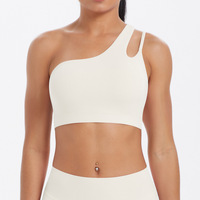 Sujetador deportivo asimétrico de un solo hombro para mujer al por mayor, con espalda recortada, transpirable, de Spandex/Nylon, soporte medio, a prueba de golpes, para correr y gimnasio.