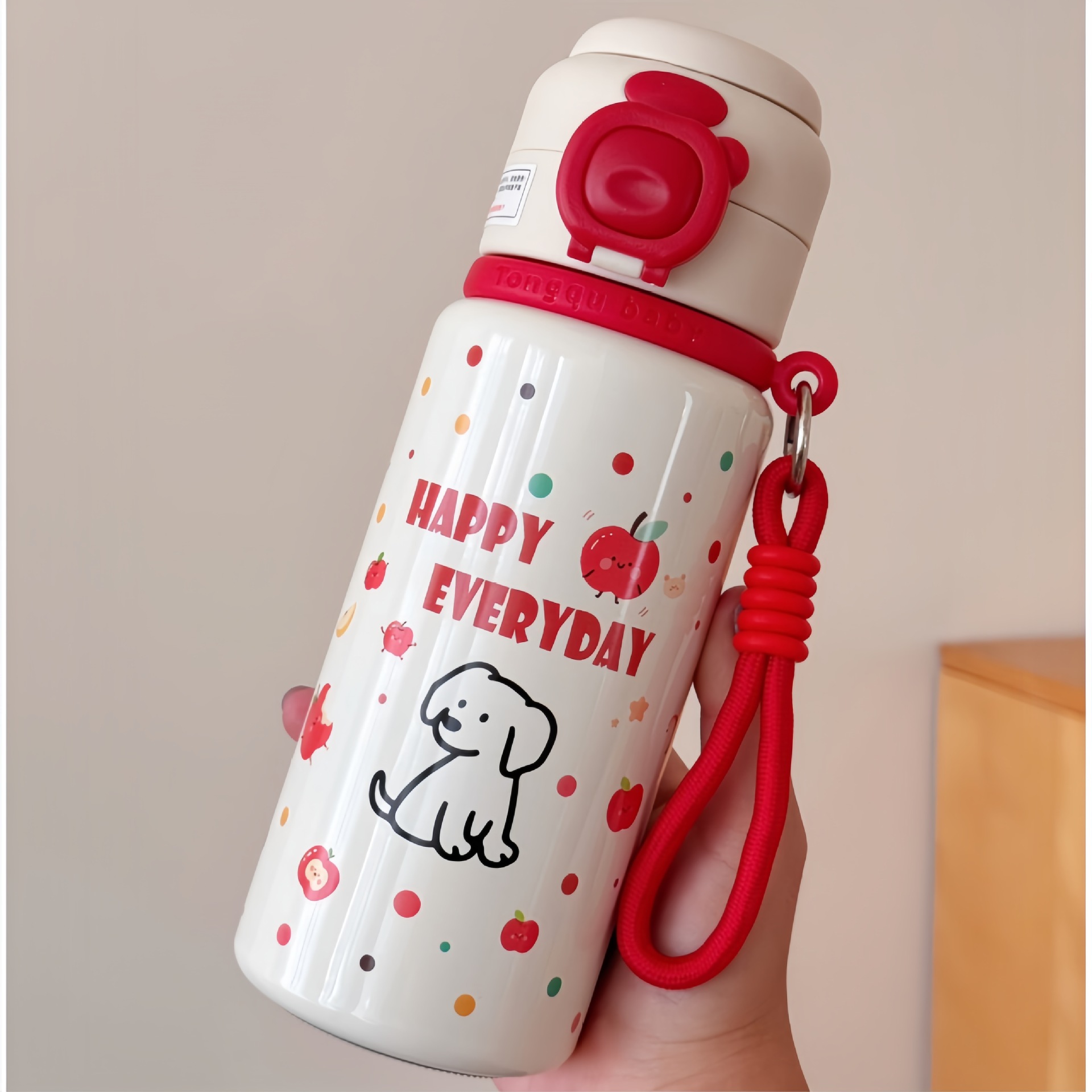 Chiot avec cordon rouge