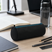 Étui à crayons cylindrique noir en toile avec fermeture éclair bleue et doublure turquoise pour l'école et le bureau