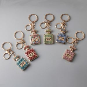 Llavero de Metal con Colgante Redondo de Cristal de Lujo, Amuleto de Brújula Esmaltado Personalizado de Estilo Vintage, Perfecto para Regalo - Product Image 1