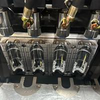 Moule de soufflage semi-automatique premium à 4 cavités pour bouteilles en plastique PET, idéal pour les bouteilles de boissons et d'eau minérale